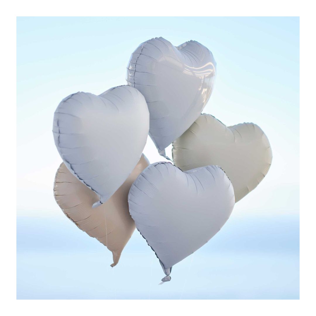 Heart-shaped balloons in white and beige on a blue sky background - Remarkable Parties